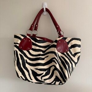 Zebra print tote bag with red accents